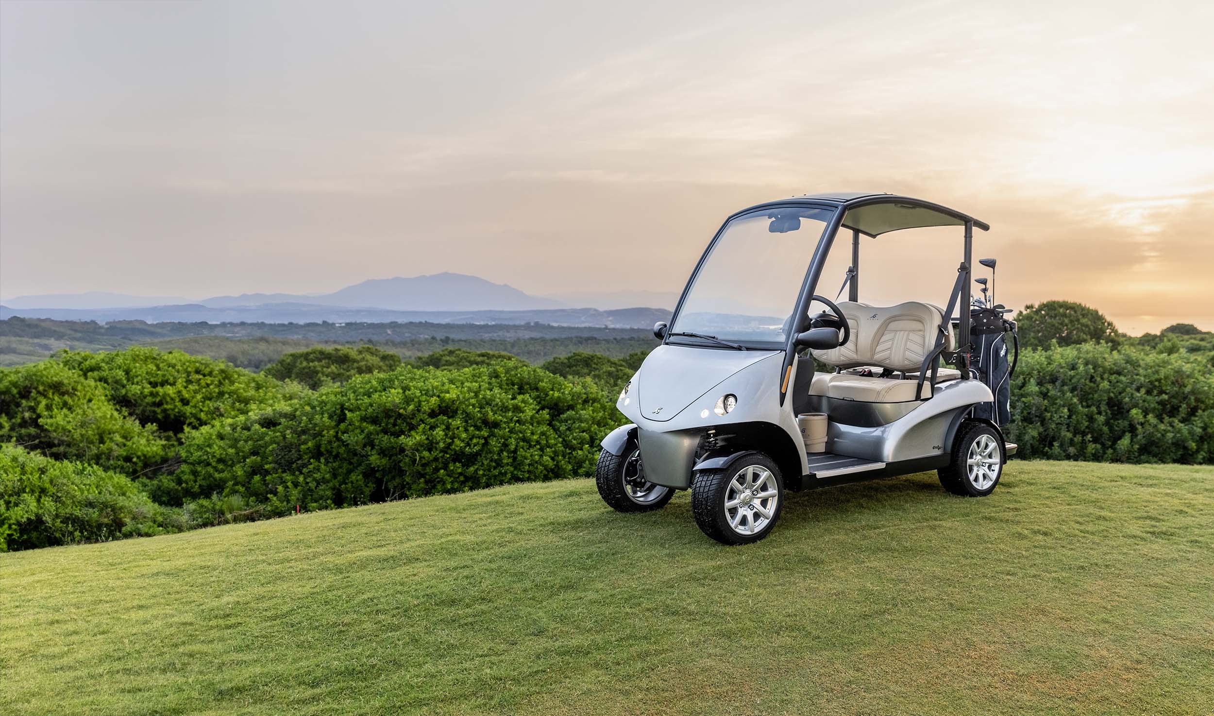 Golf cart with nice background sunset